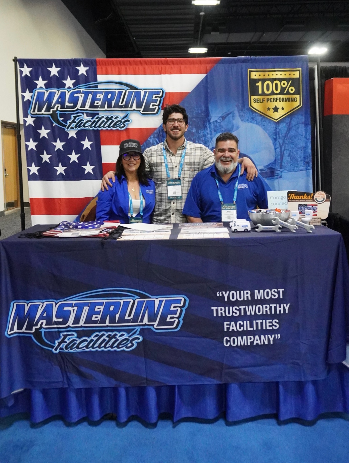 Tim Yslava with his mother and father at the Masterline Facilities trade show booth
